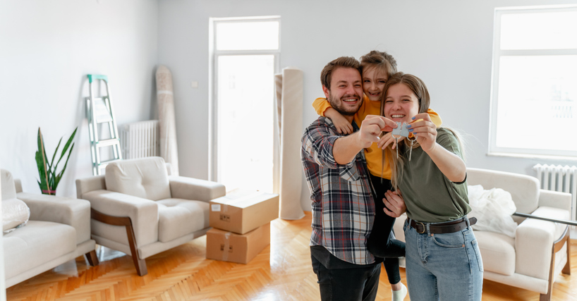 young family show keys to own home, happy couple buying first house together, smiling husband and wife purchase new property. Ownership concept